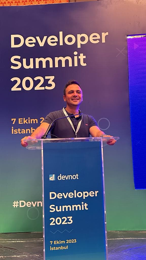 Yunus Emre speaking at the Devnot Developer Summit 2023 in Istanbul